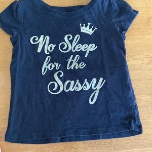 Black shirt with gold lettering